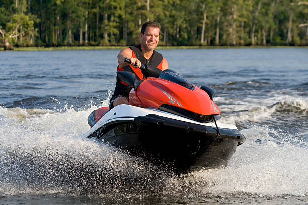 Man riding wave runner in river  jet boat stock pictures, royalty-free photos & images
