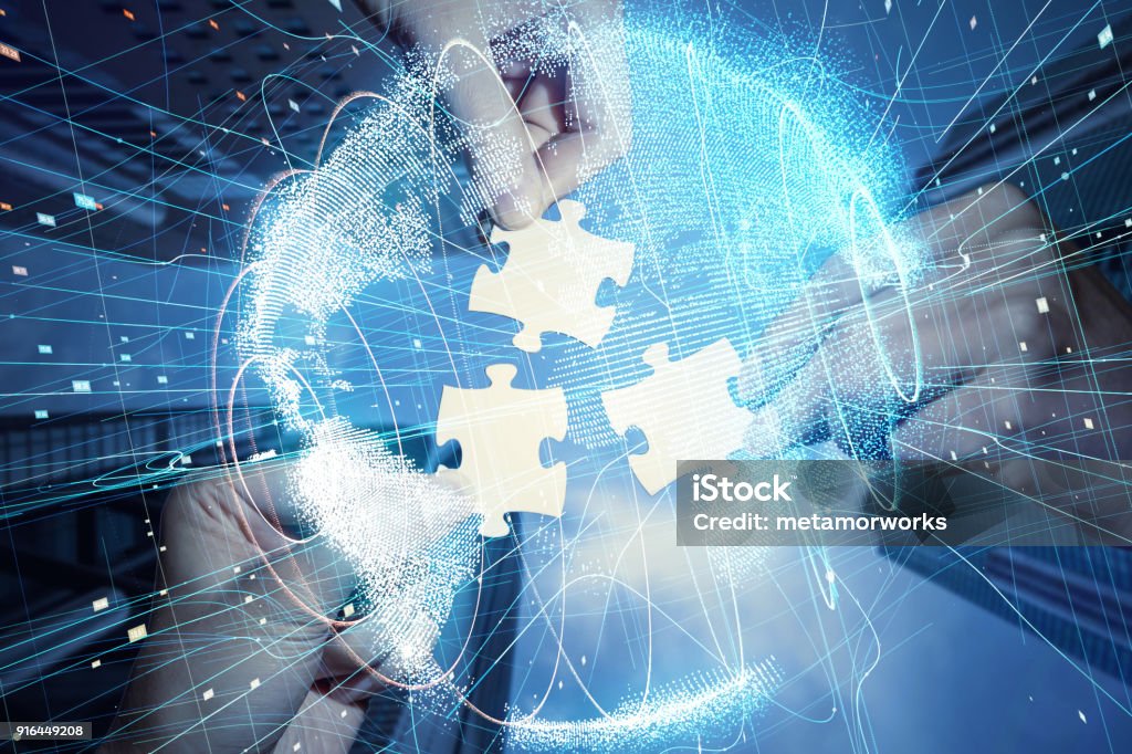 Pieces of jigsaw puzzle and global network concept. Technology Stock Photo