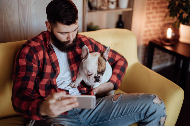 istock Young hipster man taking selfie with his dog 916454396