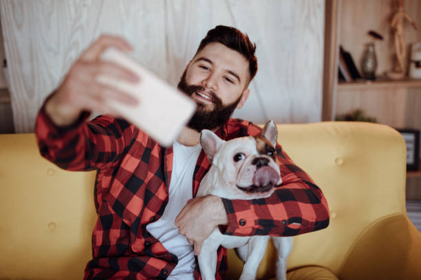 istock French bulldog taking selfie with his owner 916455030