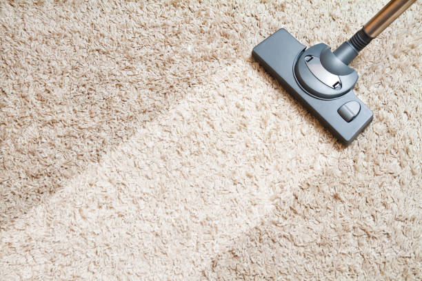 Cleaning carpet Cleaning carpet by vacuum cleaner carpet stock pictures, royalty-free photos & images