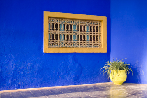 Beautiful colorful building exterior with outdoor garden Morocco architecture style. Architecture design, travel concept.