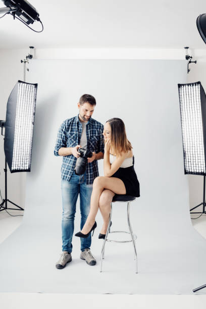 istock Professional photographer and young model 916460012