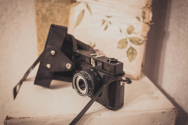 istock Vintage film camera with leather case on white background 916460336