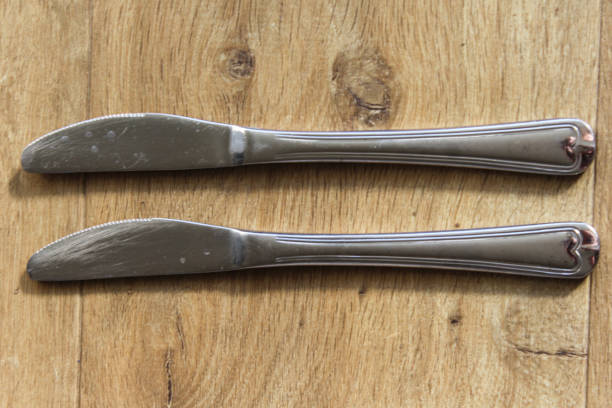 close up of two silver butter knive
