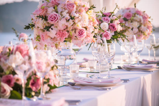 istock Table setting at a luxury wedding and Beautiful flowers on the table. 916467980