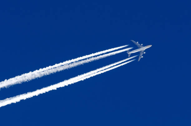 istock Airplane big four engines aviation airport contrail clouds. 916468700