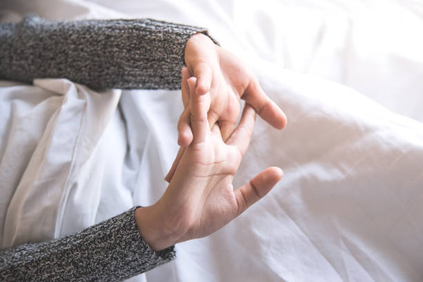 woman stretching in bed after wake up.