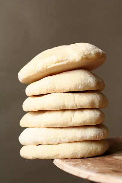 istock Stack of pita bread on the edge of a table 91647174