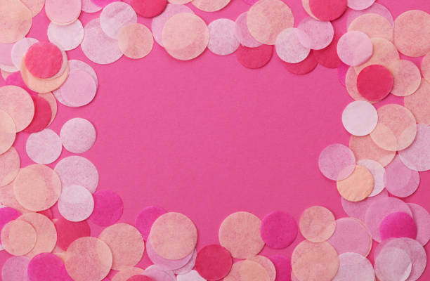 istock Pink confetti on pastel pink background. Festive background  for your design. 916472226