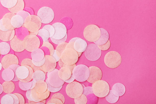 istock Pink confetti on pastel pink background. Festive background  for your design. 916472274