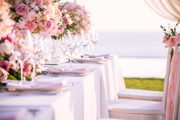 istock Table setting at a luxury wedding and Beautiful flowers on the table. 916472322