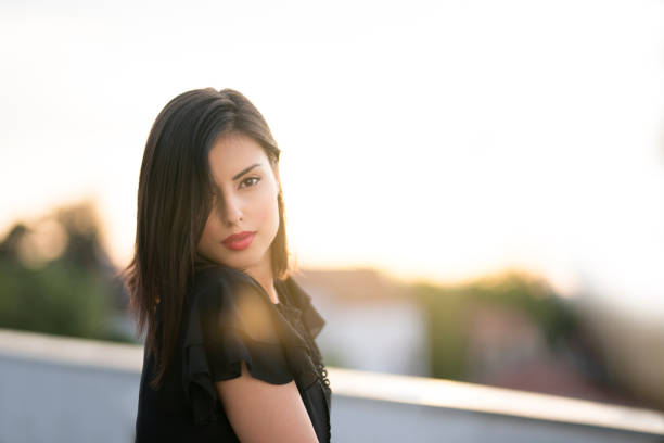 girl, retro camera and the beautiful sunset sky
