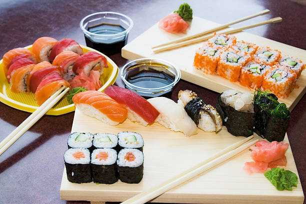 istock sushi rolls with sauce on plates 91647336