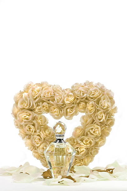 Heart of roses with crystal bottle stock photo