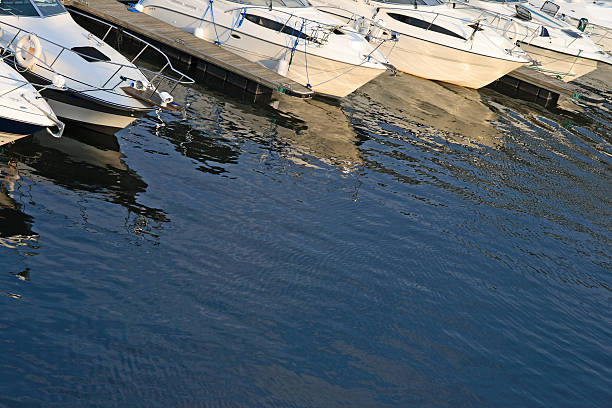 istock Motorboats reflections in water 91647484