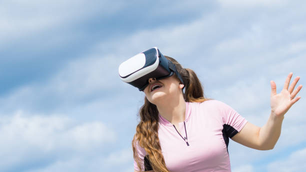 istock Woman wearing VR outside 916475278