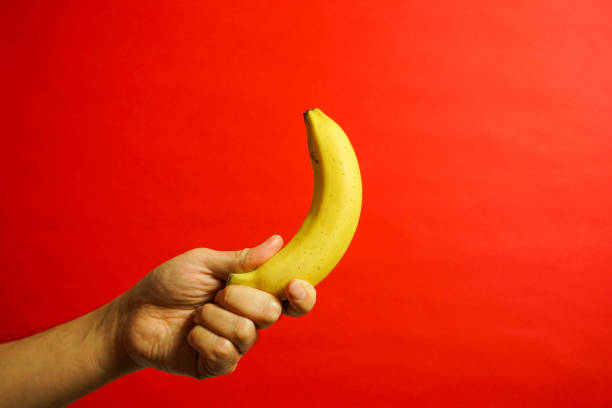 yellow banana, red background