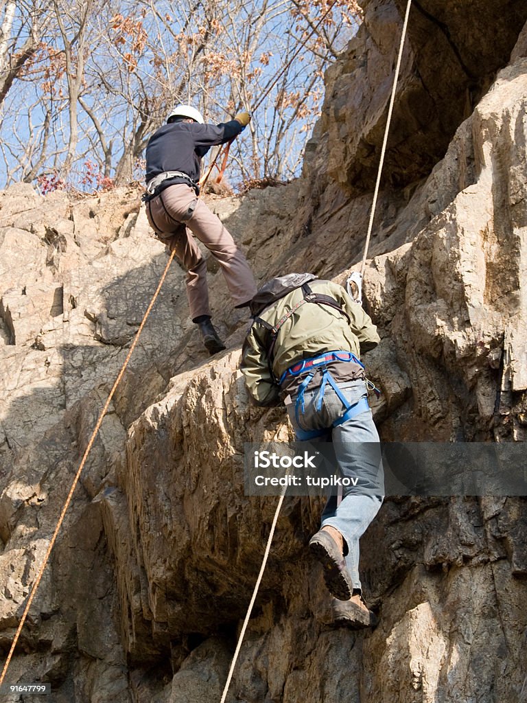 Gara di arrampicata montagna - Foto stock royalty-free di Adulto