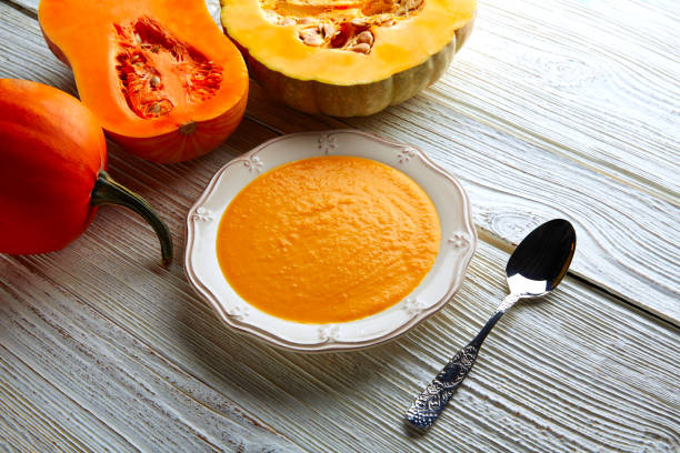 istock Pumpkin soup cream on wood 916478770