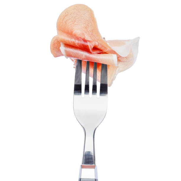 Italian prosciutto crudo or spanish jamon. Raw ham. Isolated on white background.