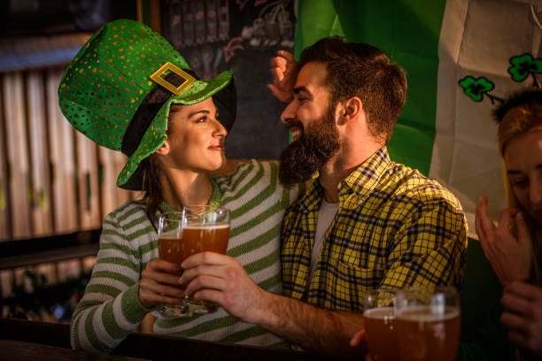 istock Group of Friends Celebrating St Patrick's Day at Beer Pub 916479230