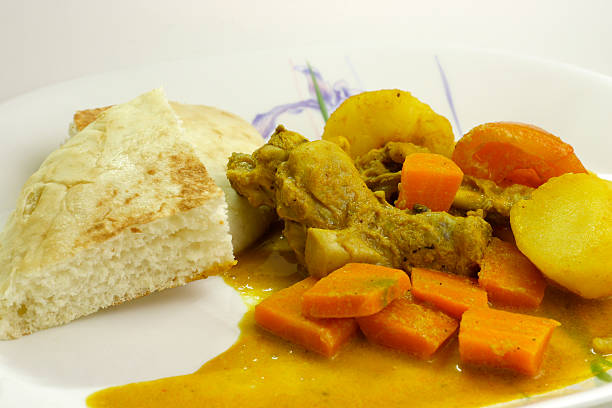 Curry chicken with bread stock photo