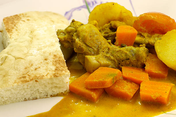 Curry Chicken with bread - close up stock photo