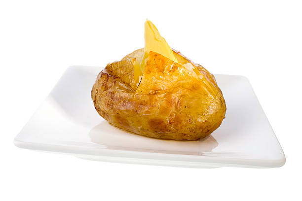 Roast potatoes on a plate - white background