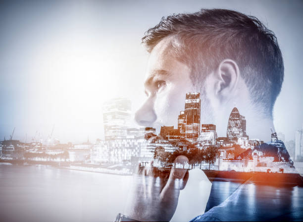 istock Young businessman thinking. Double exposure city background. 916493068