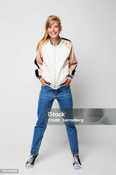 Confident Varsity Girl Stock Photo - Download Image Now - Full Length, Standing, One Woman Only