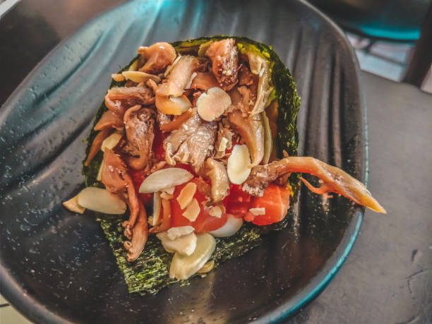 istock Salmon temaki with shimeji and peanuts  Hand Roll Sushi 916494094
