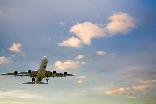 istock Four Engine Commercial Jet Flying in Twilight Sky 91649676