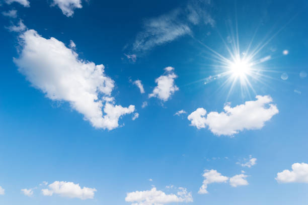 istock Blue sky background with the sun,Blue sky with white clouds floating in the sky. 916496978