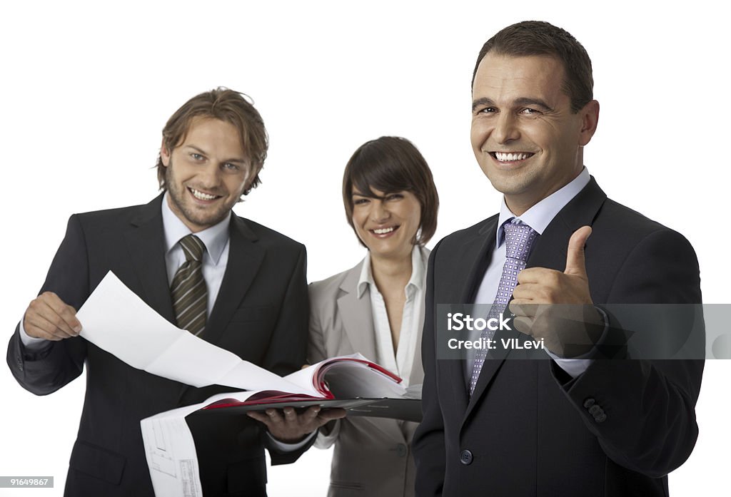 three businesspeople thumb up  Adult Stock Photo