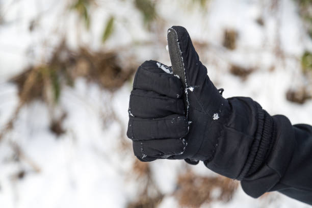 istock Hand in winter glove gesture thumb up 916503796