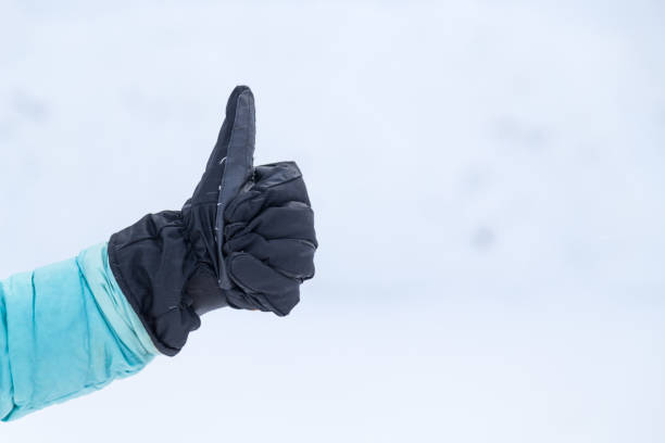 istock Hand in winter glove gesture thumb up 916503924