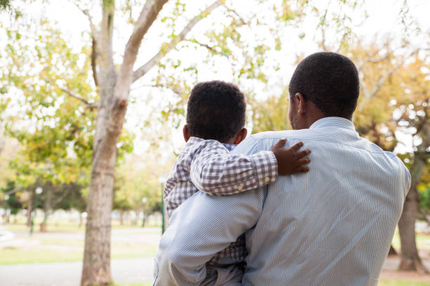 istock Dad holding his beautiful son in his arms. 916512180