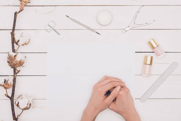 istock cropped image of woman sitting at table with manicure tools 916512946