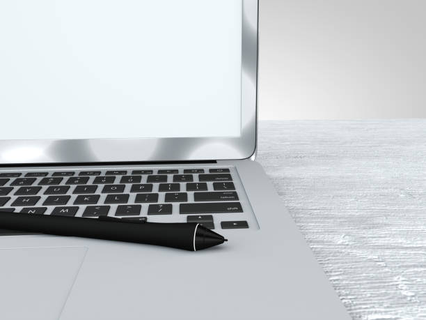 istock Digital pen and laptop, work, graphics, idea. Wooden desk 916515314
