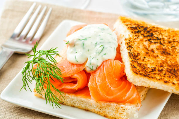 Swedish style gravlax Swedish style gravlax (gravad lax), cured salmon with dill served on toast. gravad stock pictures, royalty-free photos & images