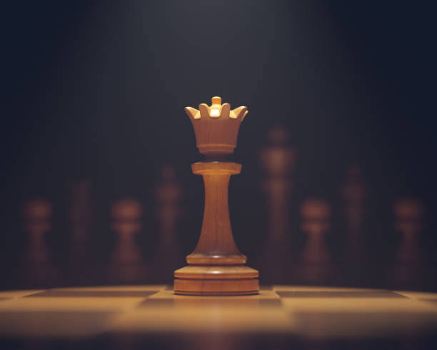 The Queen In Highlight The queen in highlight. Pieces of chess game, image with shallow depth of field. king chess piece stock pictures, royalty-free photos & images