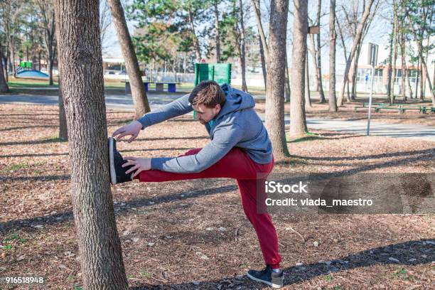 Men Stretching Before Workout Outdoors Stock Photo - Download Image Now - 20-29 Years, 30-34 Years, Active Lifestyle