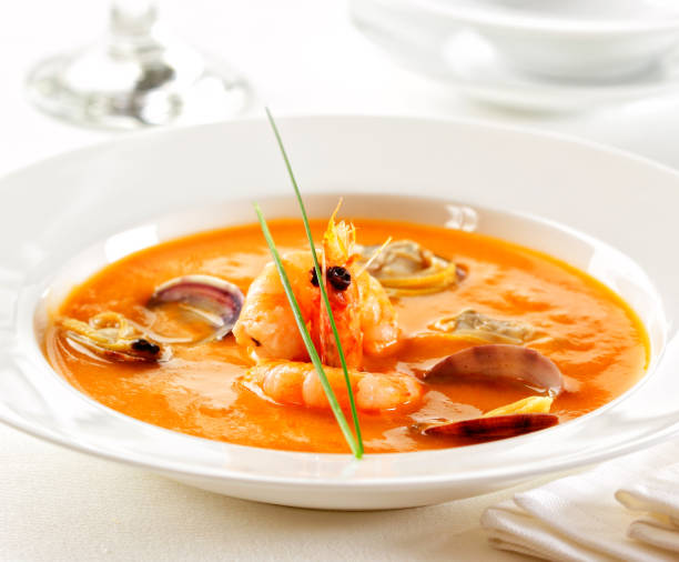 Seafood cream soup Seafood cream soup with clams and shrimps. lobster seafood photos stock pictures, royalty-free photos & images