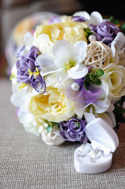 weddings bouquet and rings stock photo