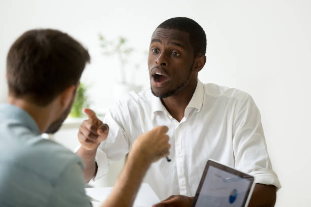 istock African-american businessman disagreeing debating during negotiations disputing with caucasian colleague 916520064