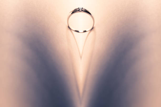 istock Platinum wedding and shadow look like a heart 916530138