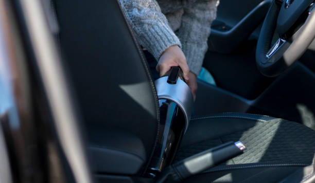 istock cleaning car seat with portable cleaner 916530358