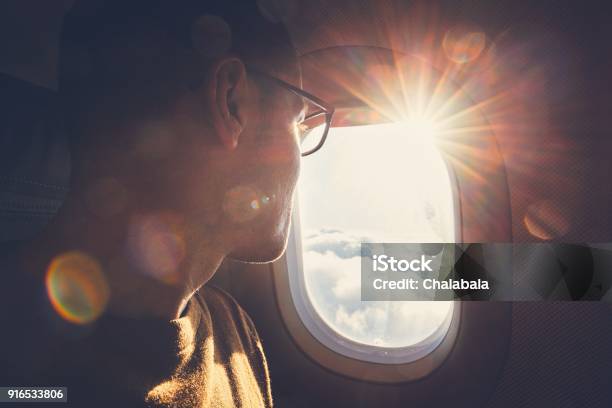 Traveling By Airplane Stock Photo - Download Image Now - Airplane, Window, Looking Through Window