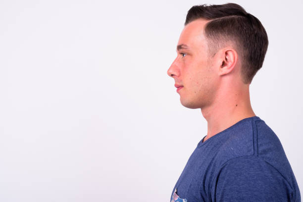 istock Profile View Of Young Man Against White Background 916534162